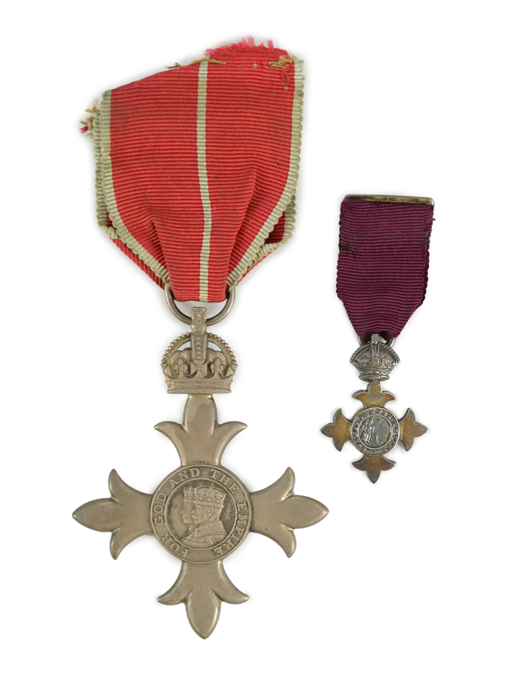 A cased George V military MBE containing leaflet with instructions as to wearing Insignia, together with the separately cased miniature